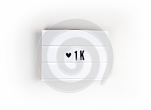 Like 1k on banner with heart icon photo