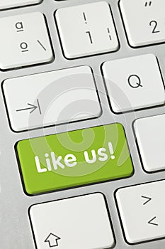 Like us! - Inscription on Green Keyboard Key