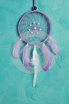 Lilac dream catcher on aquamarine
