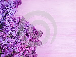 Lilac flower bouquet design beautiful decor on pink wooden background frame photo