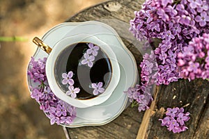 Lilac Flowers Bouquet and coffee cup.