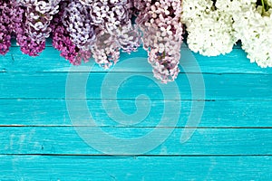 Lilac Flowers Bouquet on Wooden Plank Background