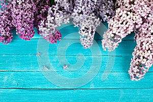 Lilac Flowers Bouquet on Wooden Plank Background