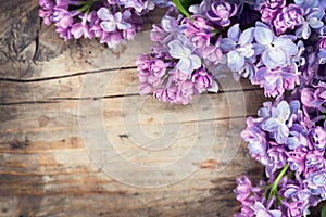 Lilac flowers bunch over wood background