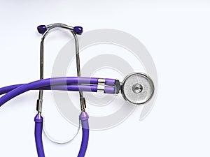 Lilac medical phonendoscope close up on white background