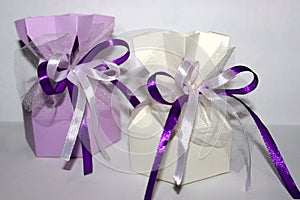 Lilac and milky gift with beautiful bows of satin ribbons and tulle