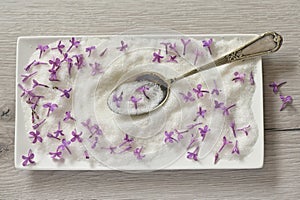 Lilac Sugar In Spoon On WoodenTable