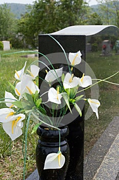 Lilies in Gravestone Vase