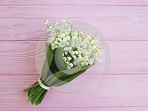 Lilies of the valley on pink wooden arrangement romance spring flowers fragrant