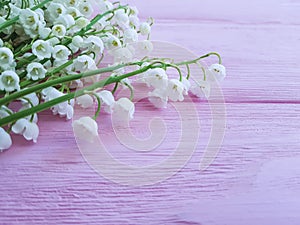 Lilies of the valley on pink wooden spring flowers fragrant