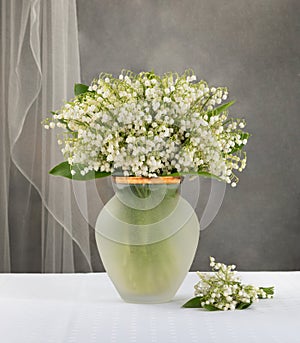 lilies of the valley vase on the table