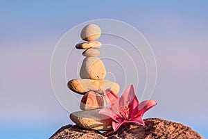 Lily at stack of pebbles