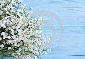 Lily of the valley beautiful on blue wooden celebration decorative floral spring flowers greetings photo