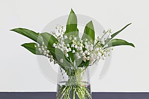 Lily of the valley flower bouquet in glass vase