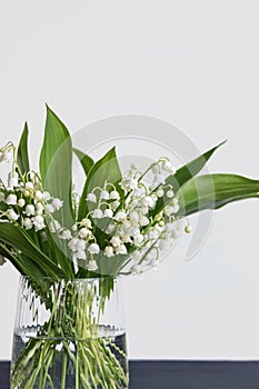 Lily of the valley flower bouquet in glass vase