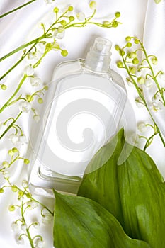 Lily of the valley and perfume bottle