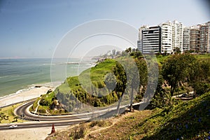 Lima, Peru - May, 2019: Beautiful view of Lima coastline from Miraflores district.route and luxury apartment blue sky background