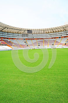 Lima Peru,new architecture of the soccer stadium- called national stadium-empty and beauty green grass