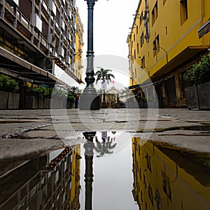 Reflections of the Plaza de Armas in the historic center of Lima, Peru photo