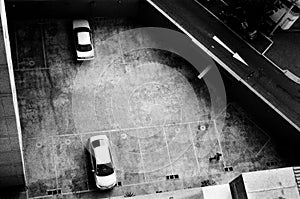 Lima two cars in a parking seen from above