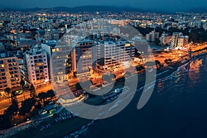 Limassol. Cyprus. Aerial view of Limassol promenade with buildings at night. Mediterranean sea coastline