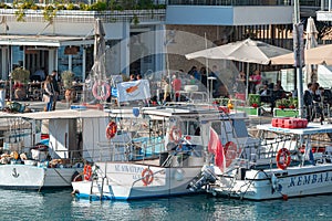 Limassol, Cyprus - January 06, 2023: View of Limassol Old Port with cafes, restaurants and moored fishing boats