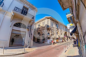 LIMASSOL, CYPRUS - MARCH 18, 2016: Street with lace and tablecloth shop in the historic center of Limassol city