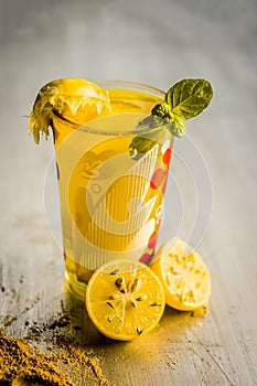 Limbo sharbat,lemon juice or Citrus Ã— limon juice with some leaves of mint in a transparent glass.