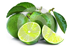 Green lime fruit with green leaf