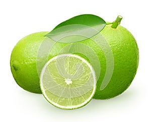 Lime fruit with green leaf next to lying and half