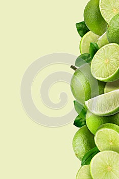Lime fruit and Lime slices on green pattern background