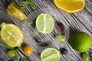 lime and fruits on wood background. top view. no photoshop used.