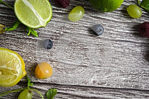 lime and fruits on wood background. top view. no photoshop used.