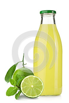 Lime juice bottle, ripe limes and mint