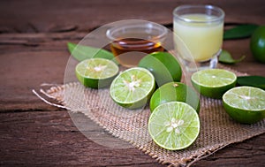a Lime lemon with juice and honey in transparent glass with sac