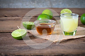 a Lime lemon with juice and honey in transparent glass with sac