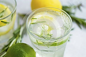 Lime and lemon mojito cocktails, fresh summer drink with ice and rosemary