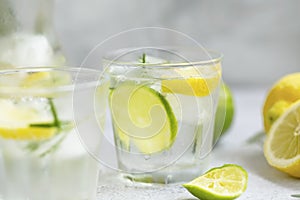 Lime and lemon mojito cocktails, fresh summer drink with ice and rosemary