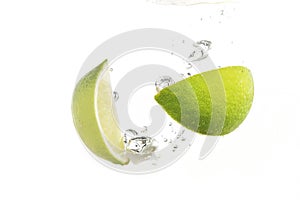 lime and lemon splashing water isolated on white background