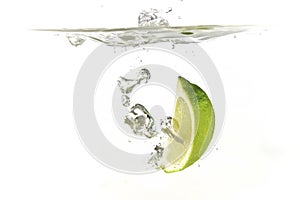 lime and lemon splashing water isolated on white background