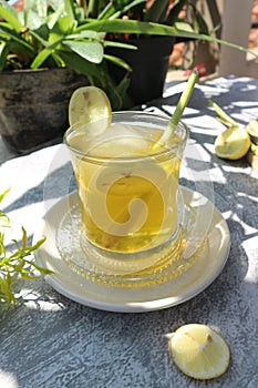 lime and lemongrass drink with ice cubes