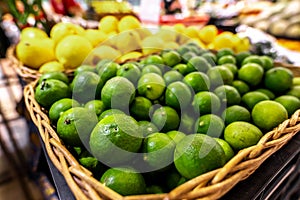 Lime and lemons background. Fresh organic lemons and lime on a local farmer food market on Bali island.