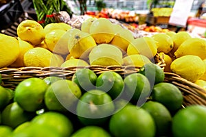 Lime and lemons background. Fresh organic lemons and lime on a local farmer food market on Bali island.