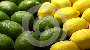 Lime and lemons background on market counter. Organic lemon on supermarket