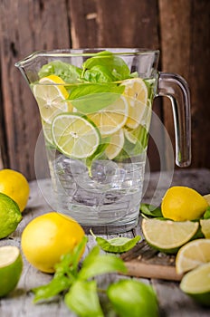 Lime lemons limonade, fresh herbs and ice in