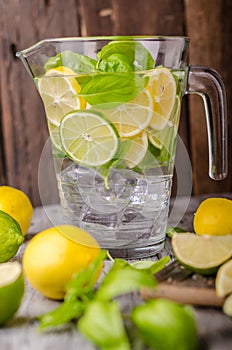 Lime lemons limonade, fresh herbs and ice in