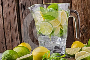 Lime lemons limonade, fresh herbs and ice in