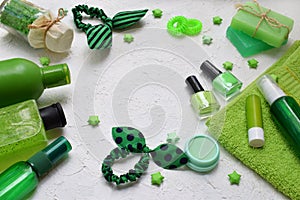 Lime mint composition beauty treatment products in green colors: shampoo, soap, bath salt, towel, oil. Various bath accessories. I