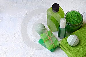 Lime mint composition beauty treatment products in green colors: shampoo, soap, bath salt, towel, oil. Various bath accessories. I