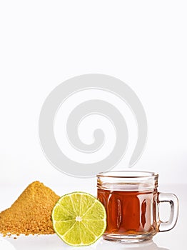 Fresh homemade aguapanela, a popular Latin American sweet drink made from unrefined whole cane sugar panela boiled in water, photo